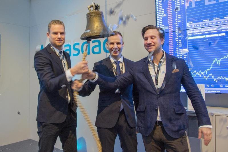 FlexQube founders ringing the NASDAQ bell