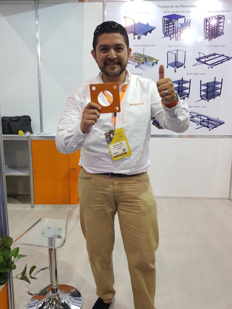 FlexQube Mexico sales manager Hector Flores wth FlexQube logo