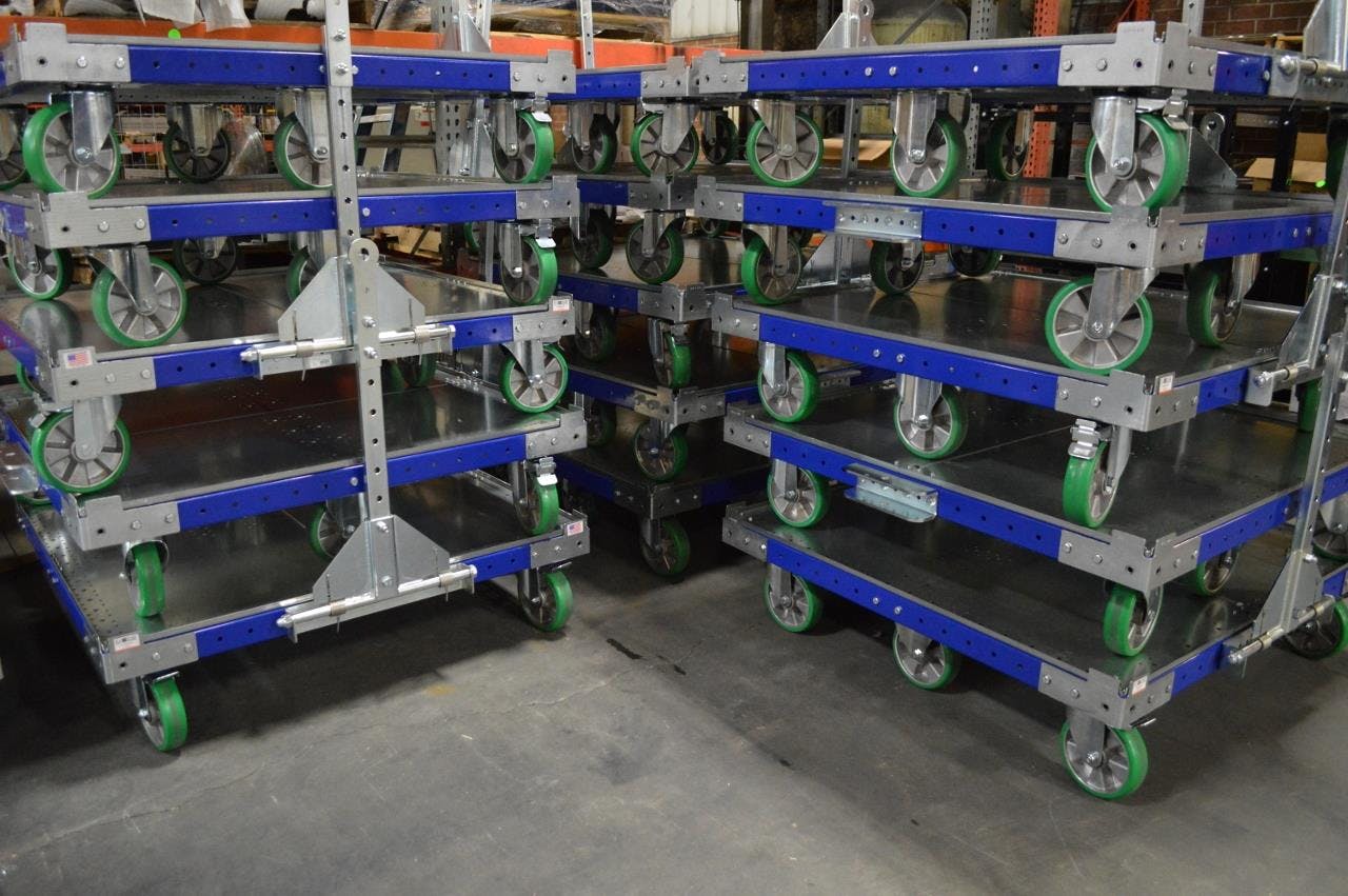 FlexQube carts stacked in a manufacturing facility